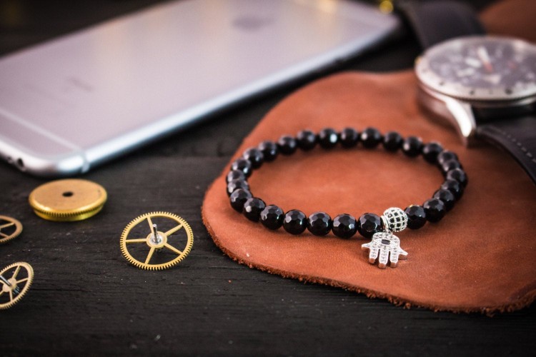 Braxx - 6mm - Black Faceted Onyx Beaded Stretchy Bracelet with Silver Micro Pave Hamsa Hand Charm from STRAPSANDBRACELETS
