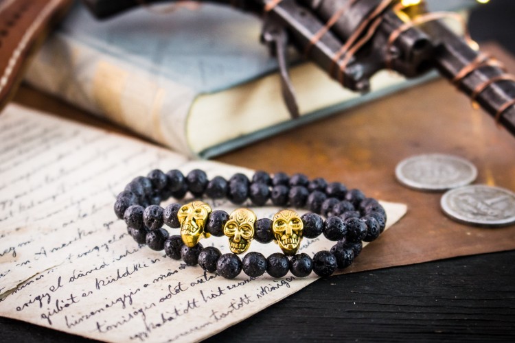 Muayyad - 6mm - Double Wrap Black Lava Stone Beaded Stretchy Bracelet with Gold Skulls from STRAPSANDBRACELETS