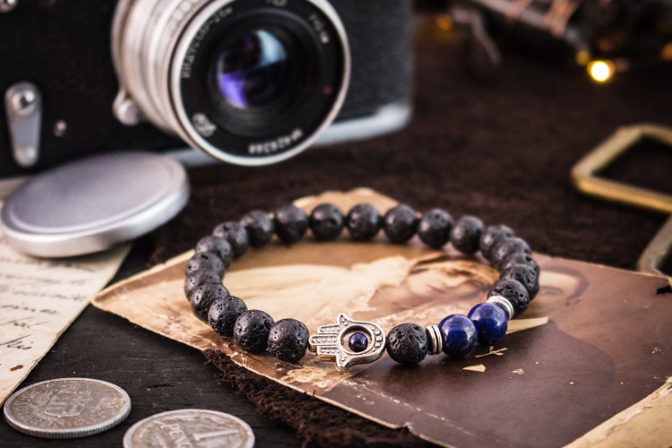Regann - 8mm - Black Lava Stone And Blue Lapis Lazuli Beaded Stretchy Bracelet with Silver Hamsa Hand from STRAPSANDBRACELETS