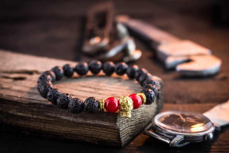 Sophocles - 8mm - Black Lava Stone And Red Imitation Coral Beaded Stretchy Bracelet with Gold Skull from STRAPSANDBRACELETS