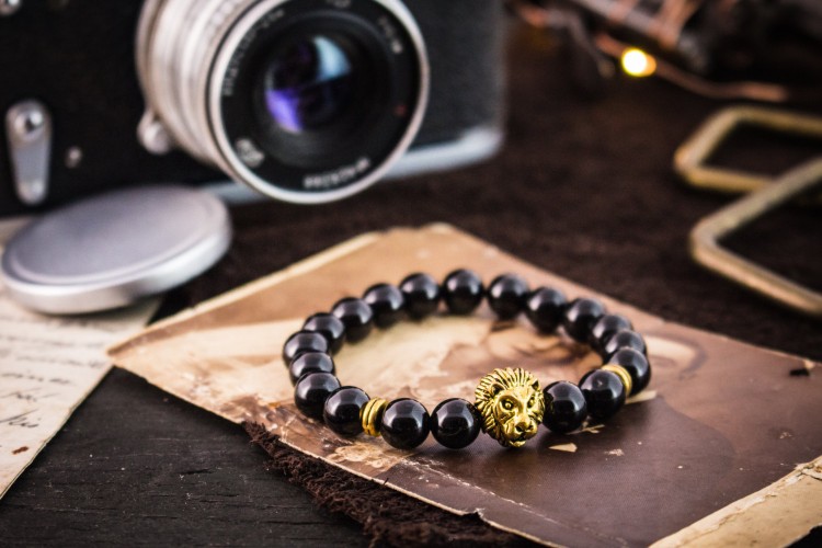 Flynn - 8mm - Black Onyx Beaded Stretchy Bracelet with Gold Lion from STRAPSANDBRACELETS