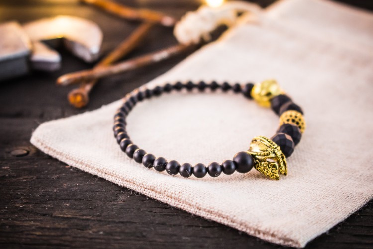Guardians I - 4-8mm - Matte Black Faceted Stretchy Beaded Stretchy Bracelet with Gold Micro Pave Bead And Helmets from STRAPSANDBRACELETS