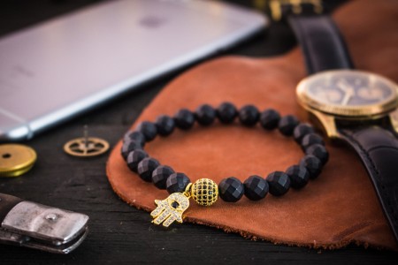 Ignas - 8mm - Matte Black Faceted Onyx Beaded Stretchy Bracelet with Gold Micro Pave Hamsa Hand Charm & Ball