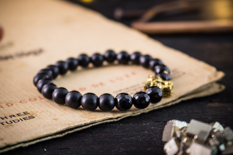 Issouf - 8mm - Matte Black Onyx Beaded Stretchy Bracelet With Gold Leopard Head & Faceted Onyx Beads from STRAPSANDBRACELETS