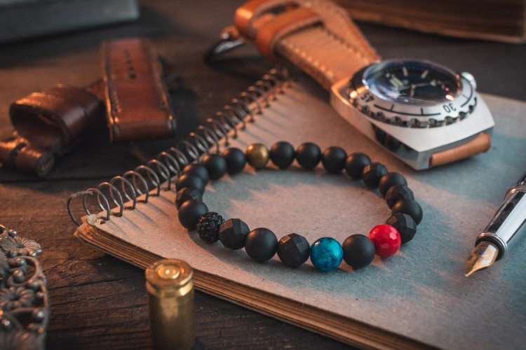 Mubeen - 8mm - Matte Black Onyx Stone Beaded Stretchy Bracelet with Red & Blue Beads from STRAPSANDBRACELETS