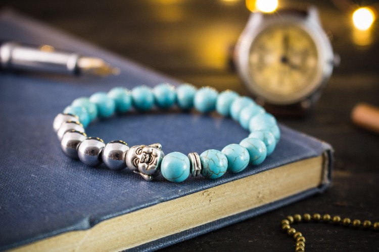 Cayrn - 8mm - Turquoise  And Silver Plated Hematite Beaded Stretchy Bracelet With Silver Laughing Buddha from STRAPSANDBRACELETS