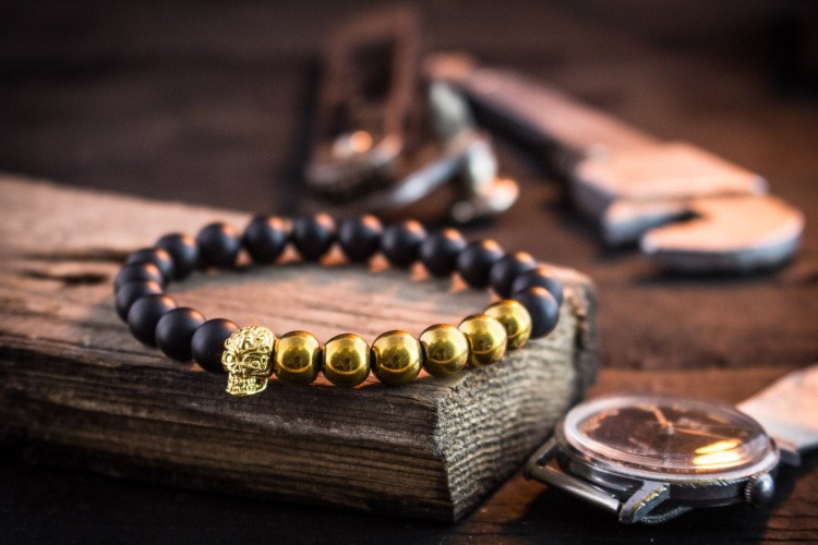 Laucklan - 8mm - Matte Black And Gold Beaded Stretchy Bracelet with Gold Skull from STRAPSANDBRACELETS